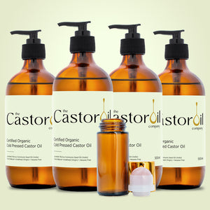 Certified organic cold-pressed castor oil, 2 litre pack of four 500ml amber glass bottles with pump dispensers and a rose quartz roll-on bottle