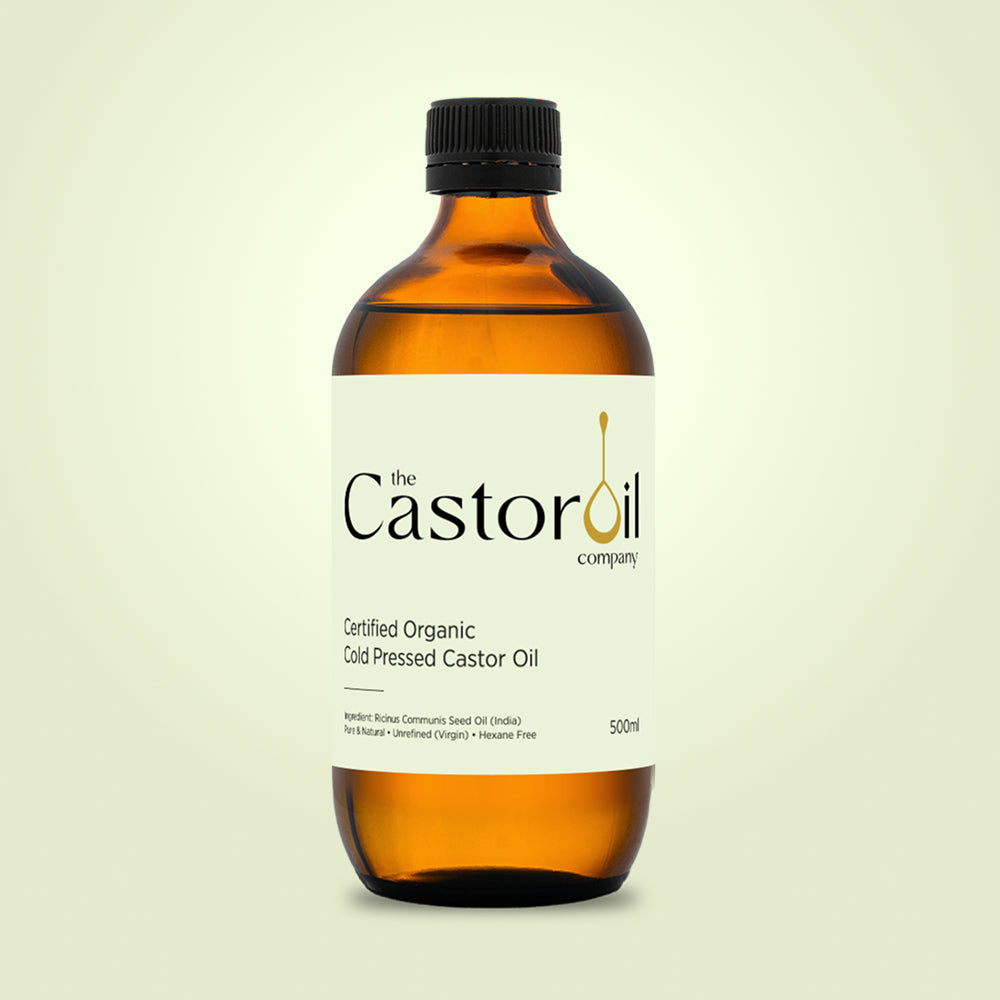 Certified organic cold-pressed castor oil in a 500ml amber glass bottle with no pump, screw cap only